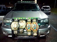 The (unofficial) Unified Puerto Rico Tag Team Championship as held by Dennis Rivera and Noel Rodriguez; the discontinued model of the WWC World Tag Team Championship belts (left) and IWA World Tag Team Championship belts (right). Campeonatos Indiscutibles.jpg