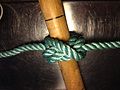 Final step of tying Cross constrictor knot: object thru the 3 loops