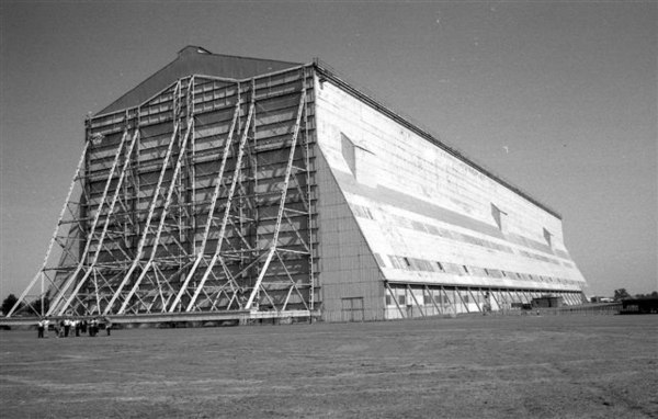 One of the two Cardington Sheds, with people in the foreground at left for scale.