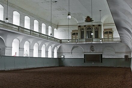 The Riding School with the royal box on the balcony in the background.