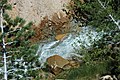 Creek eroding through hydrothermally-altered rocks (Sulphur Works, Lassen Volcano National Park, California, USA) 2 (37079627004).jpg