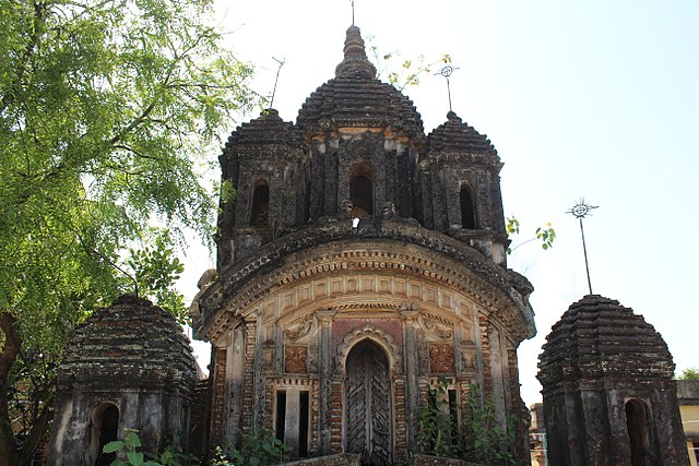 Badanganj: Damodara temple (in picture), built in 1810, with terracotta façade, and Sridhar Laljiu temple, built in 1802, with terracotta designs.