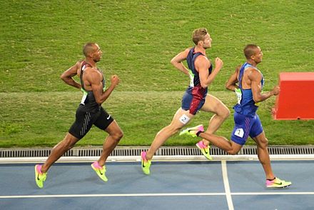 Warner (left) running in the 1,500 m at the 2016 Summer Olympics.