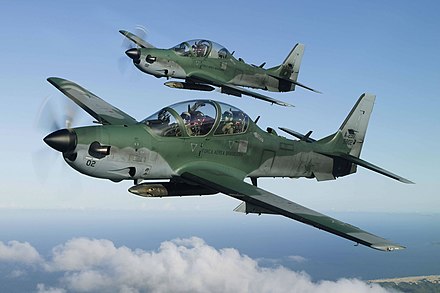 Two Embraer EMB 314 Super Tucanos of the Brazilian Air Force fly over the Amazon rainforest.