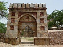The entrance gate to the Mosque from southern side Entrance archway leading to enclosure near Jamali Kamali.jpg