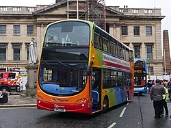 Go North East's 6050, a 2012 Volvo B9TL Wright Gemini 2 in deregulation-era heritage livery, is seen parked outside of Kingston upon Hull's Guildhall ahead of Pride in Hull 2022.