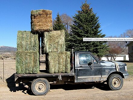 Modern small-scale transport. Pickup truck loaded with "large square" bales