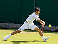 Hiroki Moriya competing in the first round of the 2015 Wimbledon Qualifying Tournament at the Bank of England Sports Grounds in Roehampton, England. The winners of three rounds of competition qualify for the main draw of Wimbledon the following week.