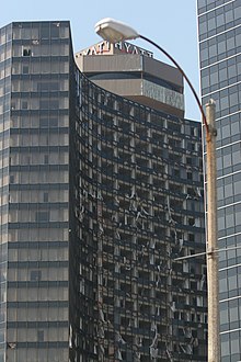 The Hyatt Regency in New Orleans two weeks after Hurricane Katrina, with broken windows. HyattBrokenWindowsIoerror.jpg