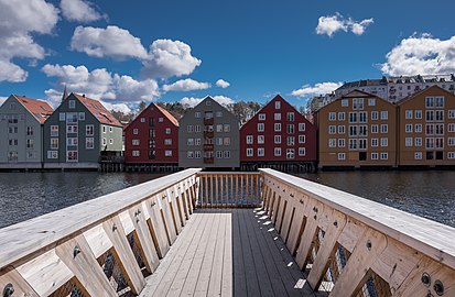 Jetty on the Nidelva river, with old storehouses in the background, Trondheim, Norway