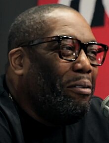 Headshot of Killer Mike smiling