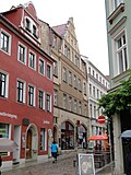 Apartment building in closed development and side wing to the courtyard