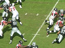 Turner (right) during a game against the Oakland Raiders. Michael Turner rushes at Atlanta at Oakland 11-2-08 1.JPG