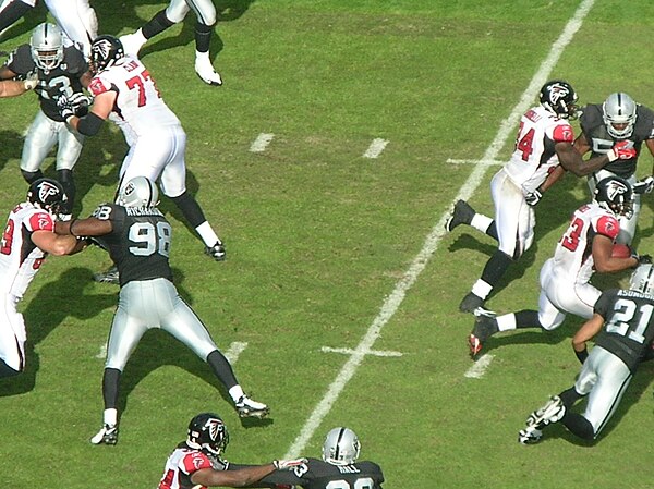 Turner (right) during a game against the Oakland Raiders.