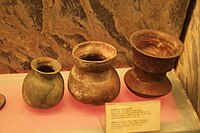 Burial pots, with the right having wave designs
