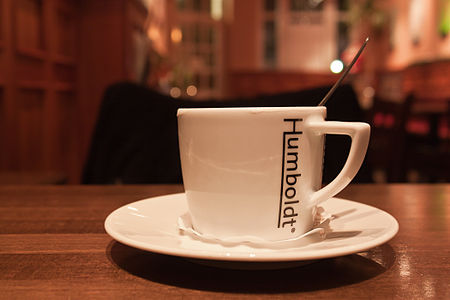 A mug shot in a (quite dimly with halogen lamps) lit restaurant.