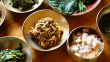 Namul (vegetable side dishes) and kongbap (lower right)