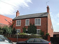 34 High Street, Arnold: Built between 1725 and 1740,[116] the Grade II listed building[19][117] is one of the oldest houses[116] – if not the oldest house – in the town.