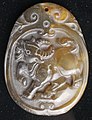 Carved ox pendant, typical Chinese zodiac figure.
