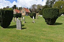 Foreground. The unmarked grave plot, Nightingale cemetery Godalming