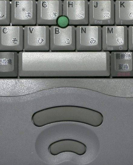 A pointing stick on a mid-1990s-era Toshiba laptop. The two buttons below the keyboard act as a computer mouse: the top button is used for left-clicking while the bottom button is used for right-clicking.