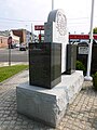 Portuguese Colonial Wars and Carnation Revolution memorial, located near the Portuguese American Center at 59 Charles Street, Lowell, Massachusetts. North and west (English) side of memorial shown.