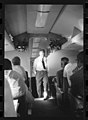 Republican presidential candidate Dwight D. Eisenhower talking with reporters(?) on his campaign airplane.jpg