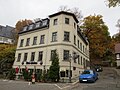 Apartment building in a previously half-open area in a corner