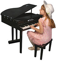 A child playing a toy piano