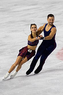 Lilah Fear and Lewis Gibson perform on the ice.