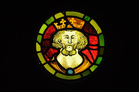 A medieval stained glass roundel of a King