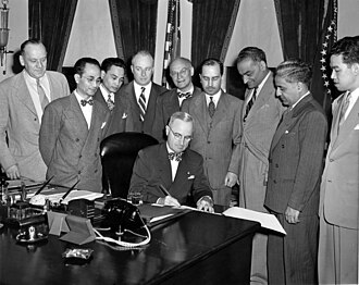 Singh, third from right, observing President Harry S. Truman signing the Luce-Celler Act of 1946. TRUMANLUCECELLER.jpg