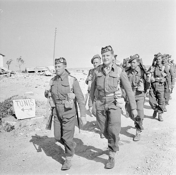 Men of the Gordon Highlanders cross the border into Tunisia, 1943.