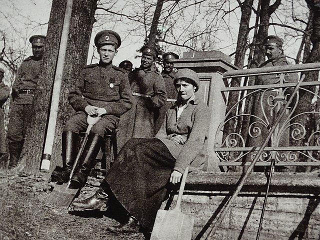 Alexei Nikolaevich and his sister Tatiana Nikolaevna surrounded by guards during their house arrest in Tsarskoye Selo, April 1917