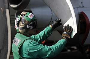 US Navy 120121-N-RG587-088 Aircrew Survival Equipmentman Airman Vironn Libranda, assigned to Carrier Airborne Early Warning Squadron (VAW) 125, cle.jpg