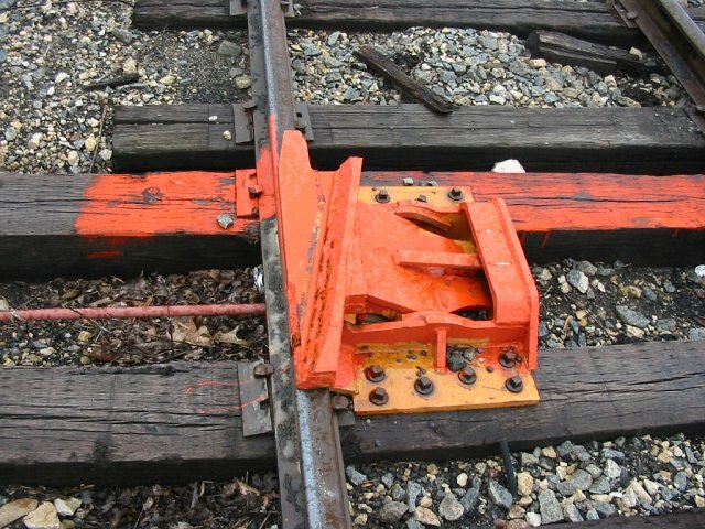 A derail device installed on a siding at Glen Haven, Wisconsin, oriented to protect track located off the bottom of the picture