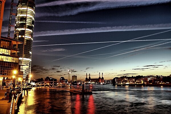 River Thames looking upstream from Vauxhall Bridge showing (left) St George Wharf Tower and (centre) Battersea Power Station, and the shorelines, left