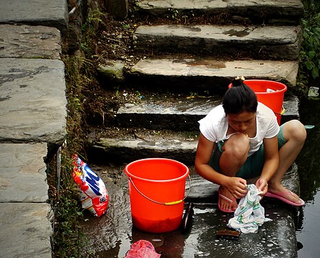 Washing clothes in a open area