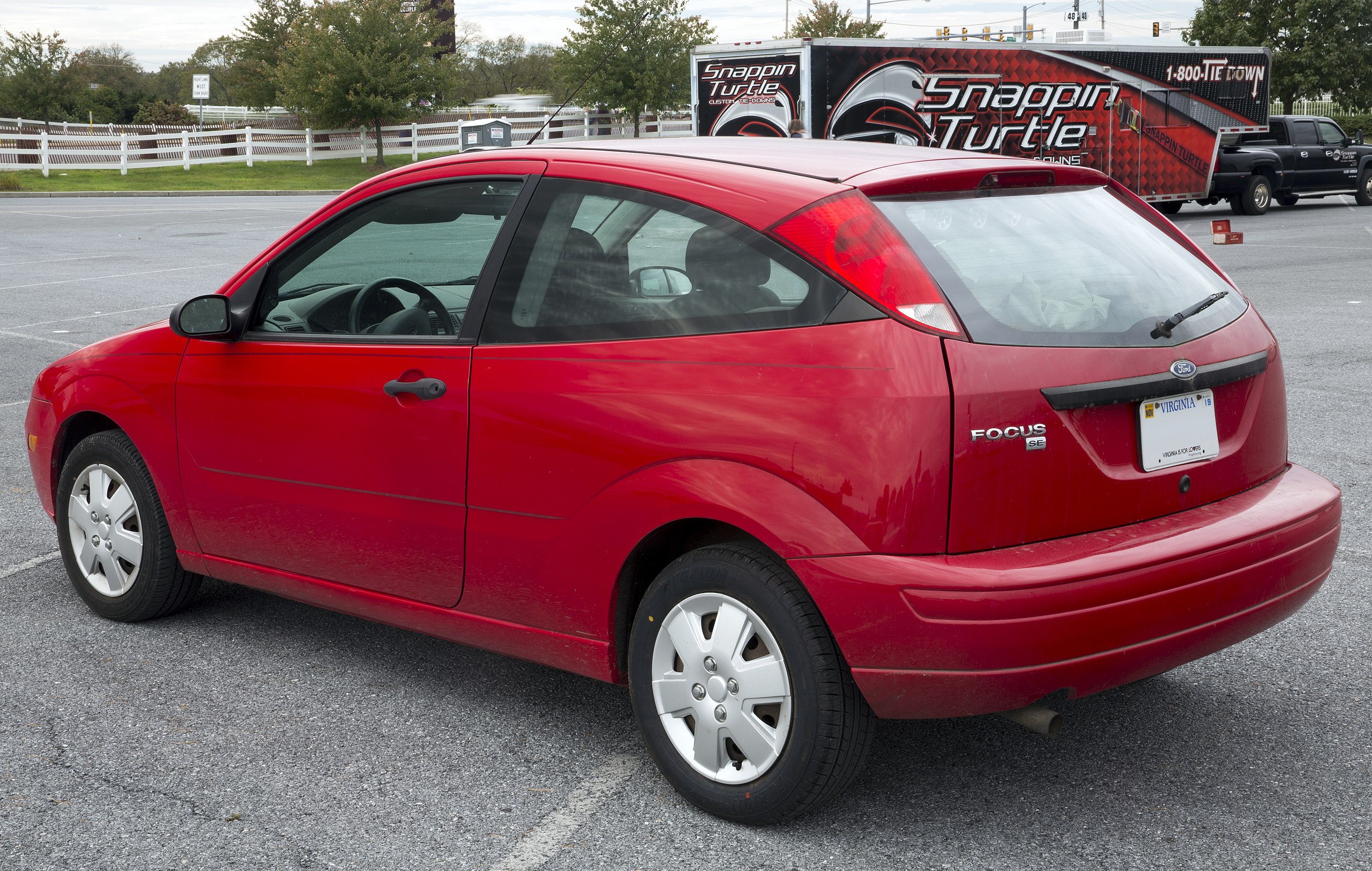 File:2007 Ford Focus SE (ZX3) in red, rear left at Hershey 2019 