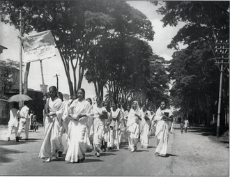 Women students of Dhaka University marching in defiance of the Section 144 prohibition on assembly during the Bengali Language Movement in early 1953 21 Feb 1953 Dhaka University female students procession.png