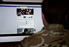 A serviceman accesses social media channels, using a desktop computer. MOD 45156050.jpg