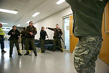 Ramsey County Sheriff's Office deputies directing a civilian during an active shooter exercise at the Arden Hills Army Training Site Active Shooter Exercise Aims to Strengthen Response 160401-Z-BC699-234.jpg