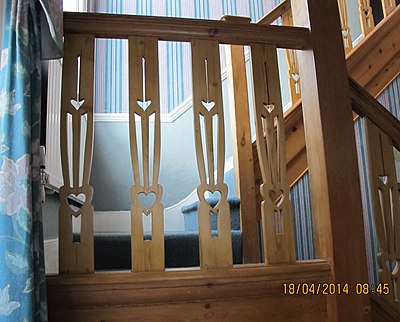 Balusters influenced by the Arts and Crafts movement in a 1905 row of houses in Etchingham Park Road (Finchley, London)