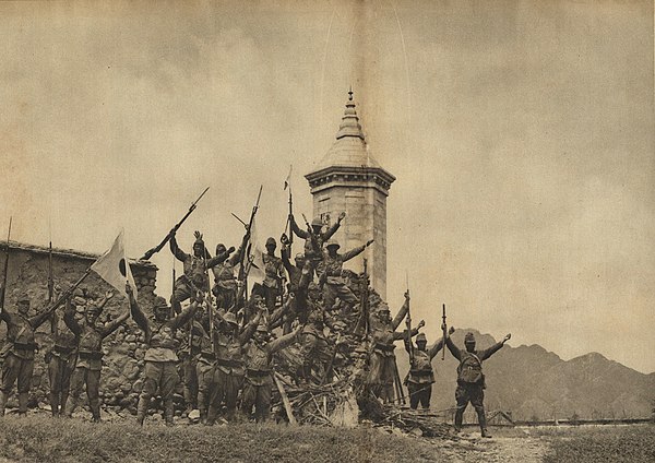 A group of Japanese soldiers during World War II shouting "banzai!" near Beijing.