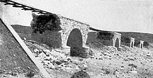 Part of 15 miles of railway line blown up in May 1917 by the Anzac and Imperial Mounted Divisions' and the Imperial Camel Corps Brigade' engineers assisted by troopers. Asluj railway bridge destroyed 1917.jpg