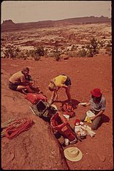 BACKPACKERS TERRY MCGAW, GLEN DENNY AND STEVE MILLER SORTING OUT FOOD ON A WEEK-LONG HIKING TRIP THROUGH WATER CANYON... - NARA - 545776.jpg