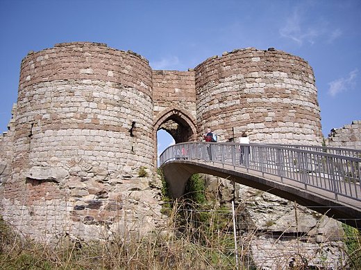 The gatehouse to the inner ward of Beeston Castle in Cheshire, England, was built in the 1220s, and has an entrance between two D-shaped towers.[94]