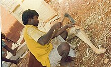 Bhuiya man of Odisha doing woodwork Bhuiya man doing woodwork.jpg