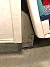 Bridge Plate locker behind seat in LIRR M7 car.jpg