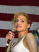 Brittany Murphy with Actor/Comedian Paul Rodriguez perform for the crew during a United Services Organization (USO) show aboard USS Nimitz June 19, 2003 (cropped)